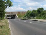 Safety barrier fitted by road just before tunnel