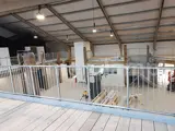 Protection barrier on balcony inside warehouse made from steel tube and Interclamp fittings