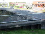 Handrail fitted with mesh panelling for pedestrian safety