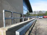 handrail system fitted at a service station in England using Interclamp tube clamp and key clamp fittings