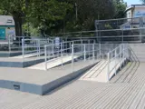 Disability ramp access with decking. Handrails and safety barrier for pedestrians