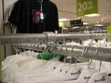 Interclamp steel tube clamp fittings on a clothing rail in a shop