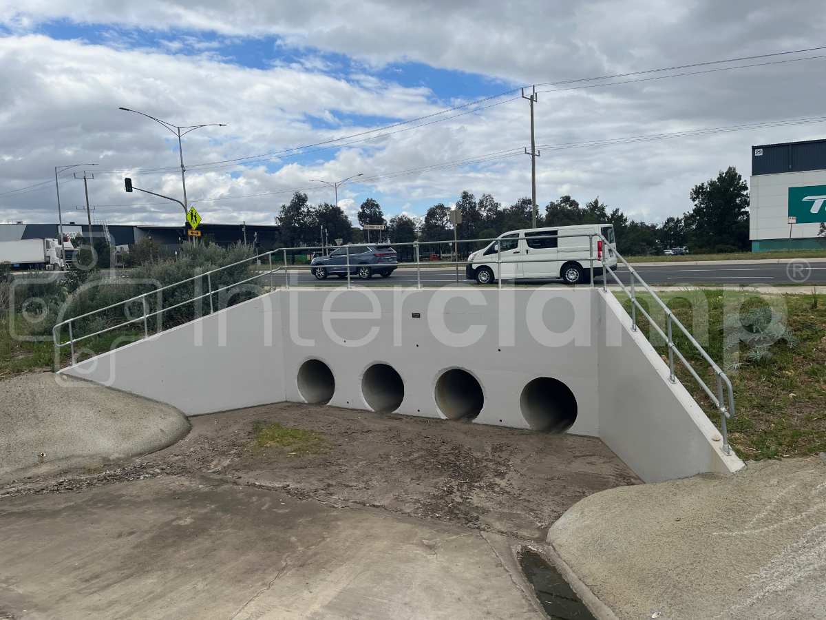 Interclamp tube clamp fittings and tube installed around a culvert. 