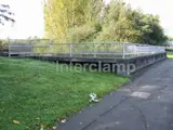 Handrail and mesh panel system fitted using Interlcamp steel tube fittings and key clamp fittings 